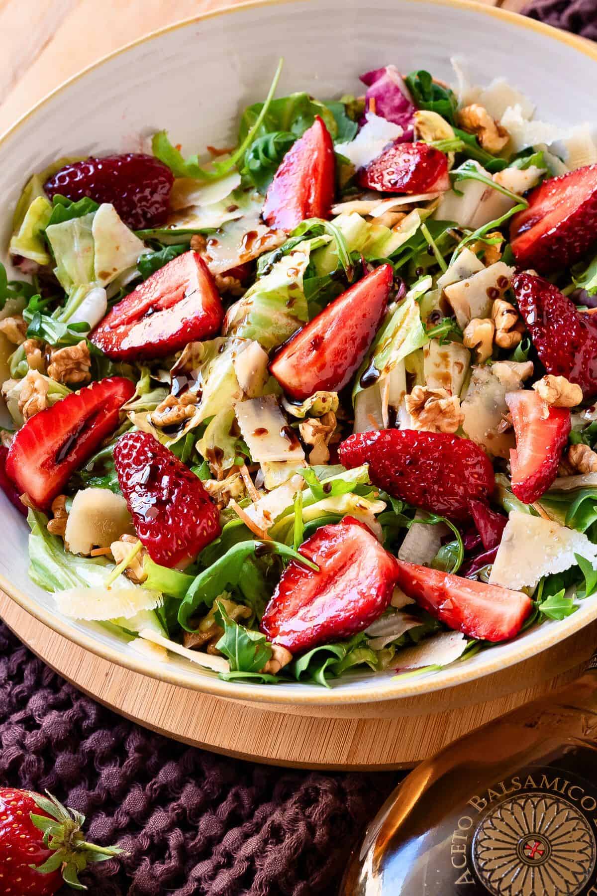 Strawberries Balsamic salad in a bowl with yellow rim.