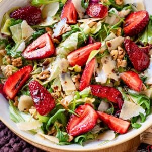 Strawberries Balsamic salad in a bowl with a yellow rim.
