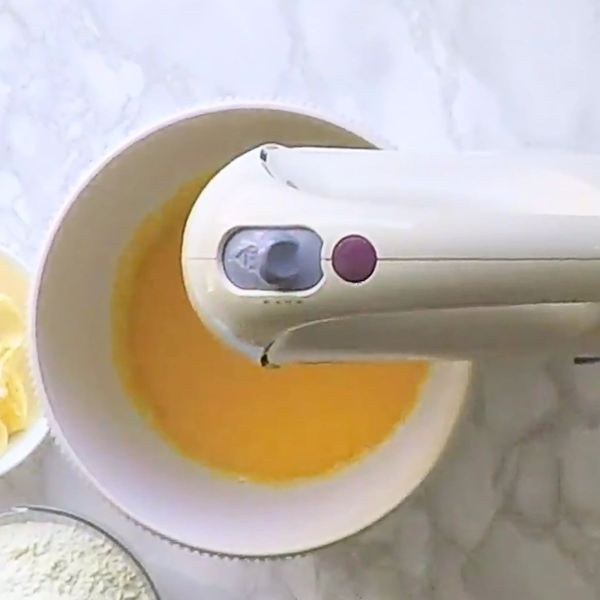 Eggs in a bowl of a stand mixer.