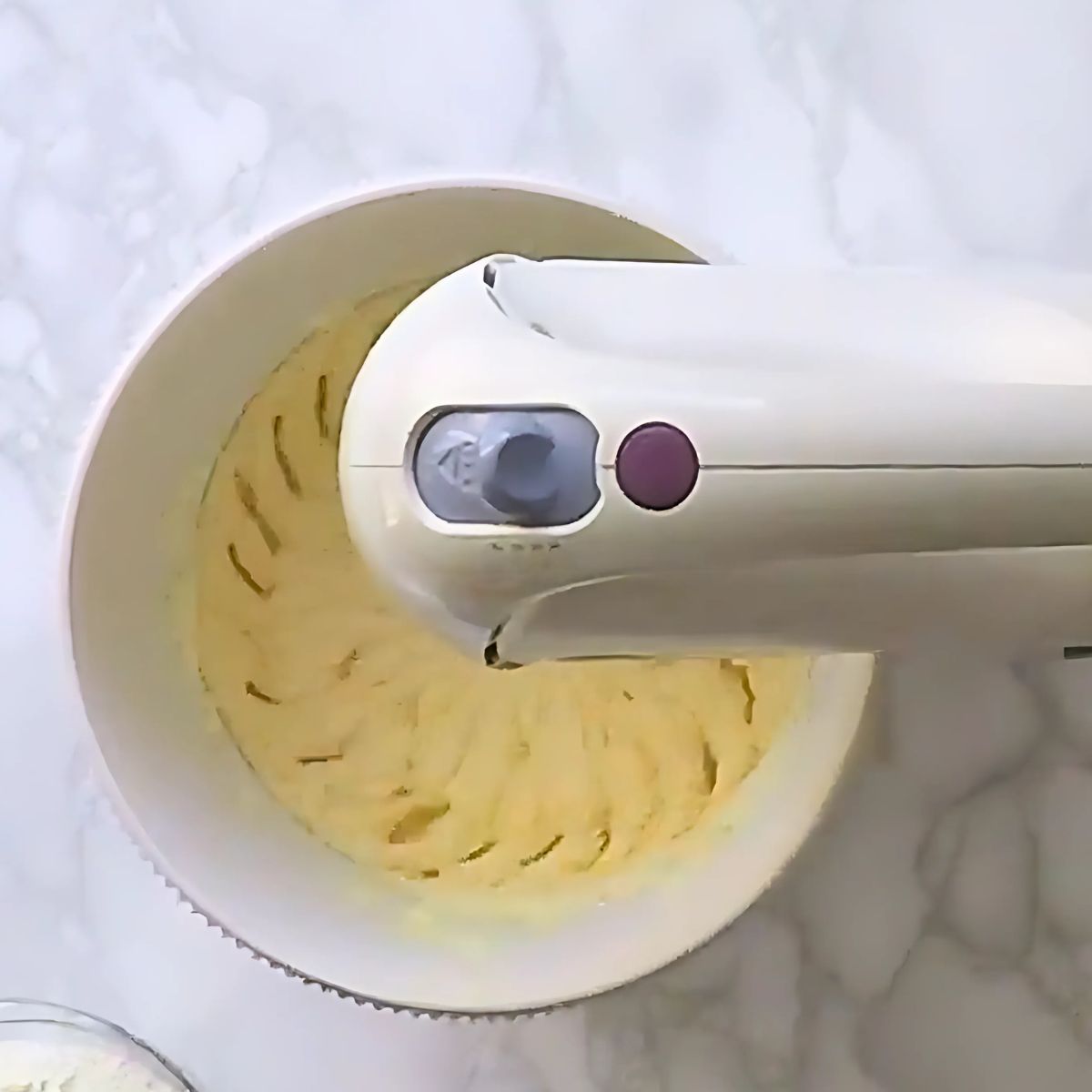 Beating eggs and butter in stand mixer.