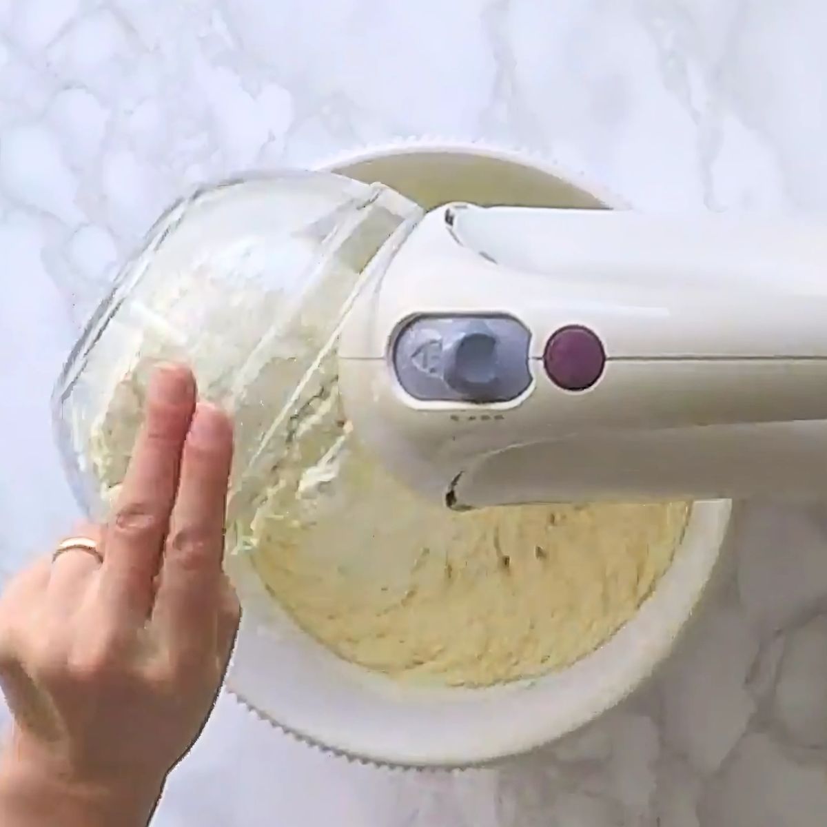 Adding flour to the eggs.