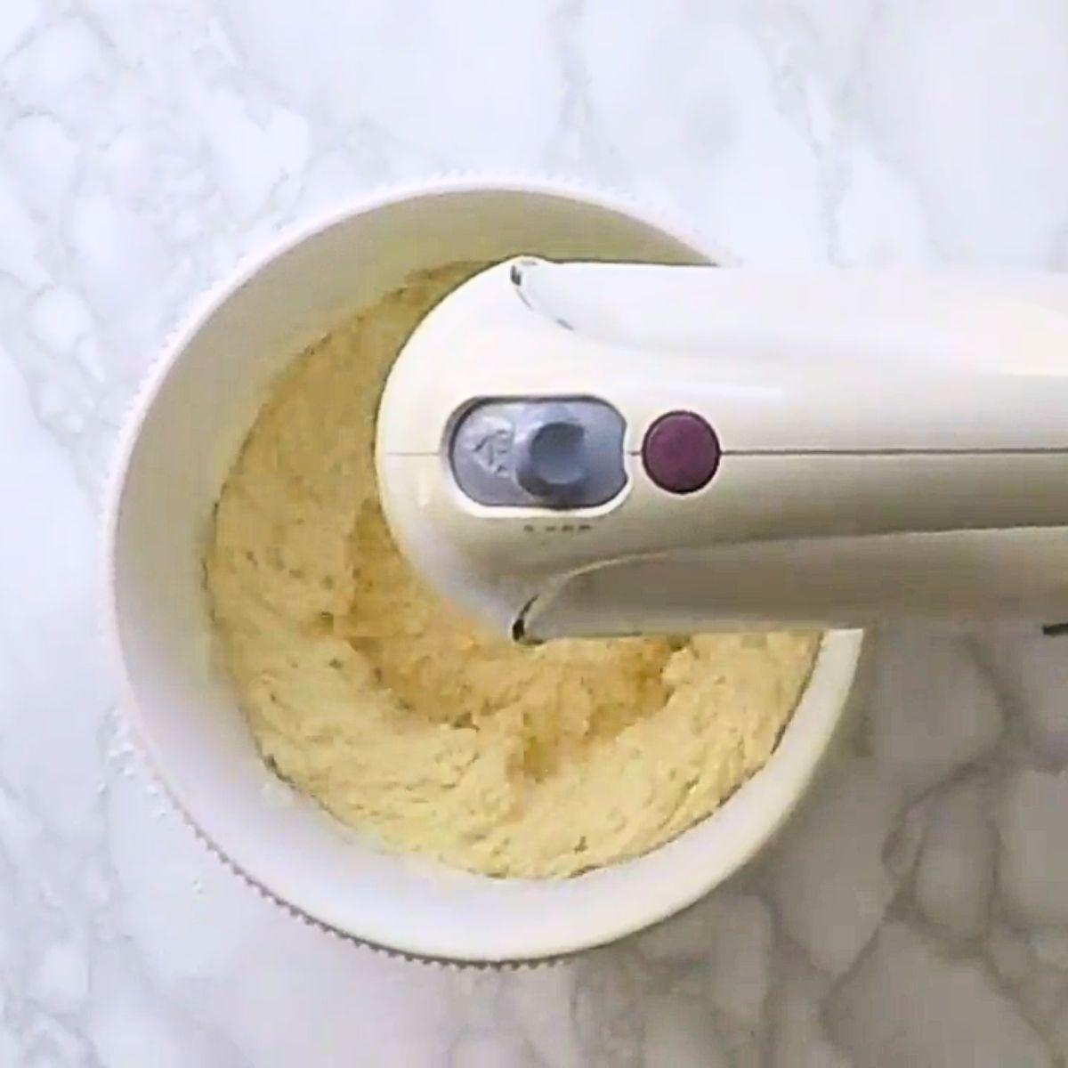 Cake batter in a stand mixer.