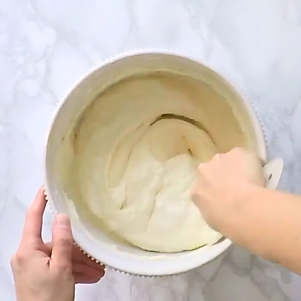 Incorporating egg whites into the batter.