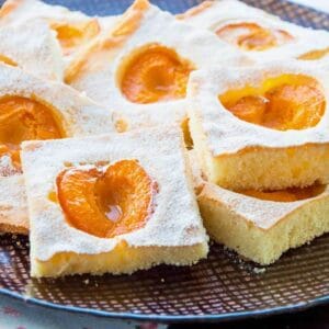 Fresh apricot cake cut into squares.