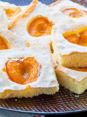 Fresh apricot cake cut into squares.