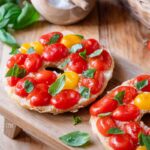 friselle with tomatoes on a wooden board