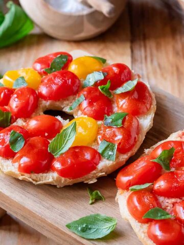 friselle with tomatoes on a wooden board