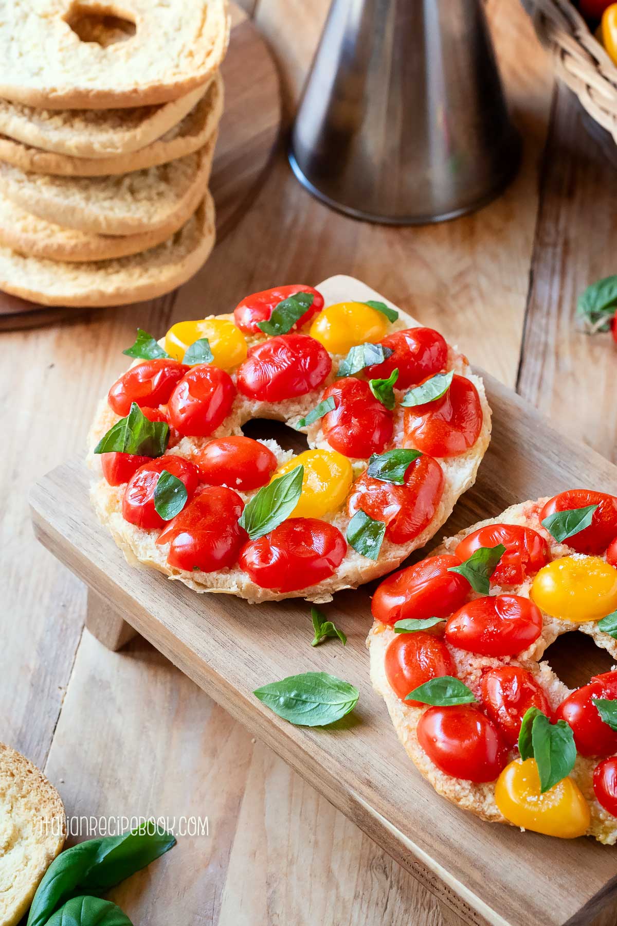 friselle with tomatoes on a wooden board