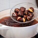 draining boiled chesnuts