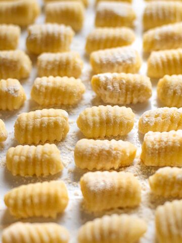 Potato gnocchi on a tray close up view.