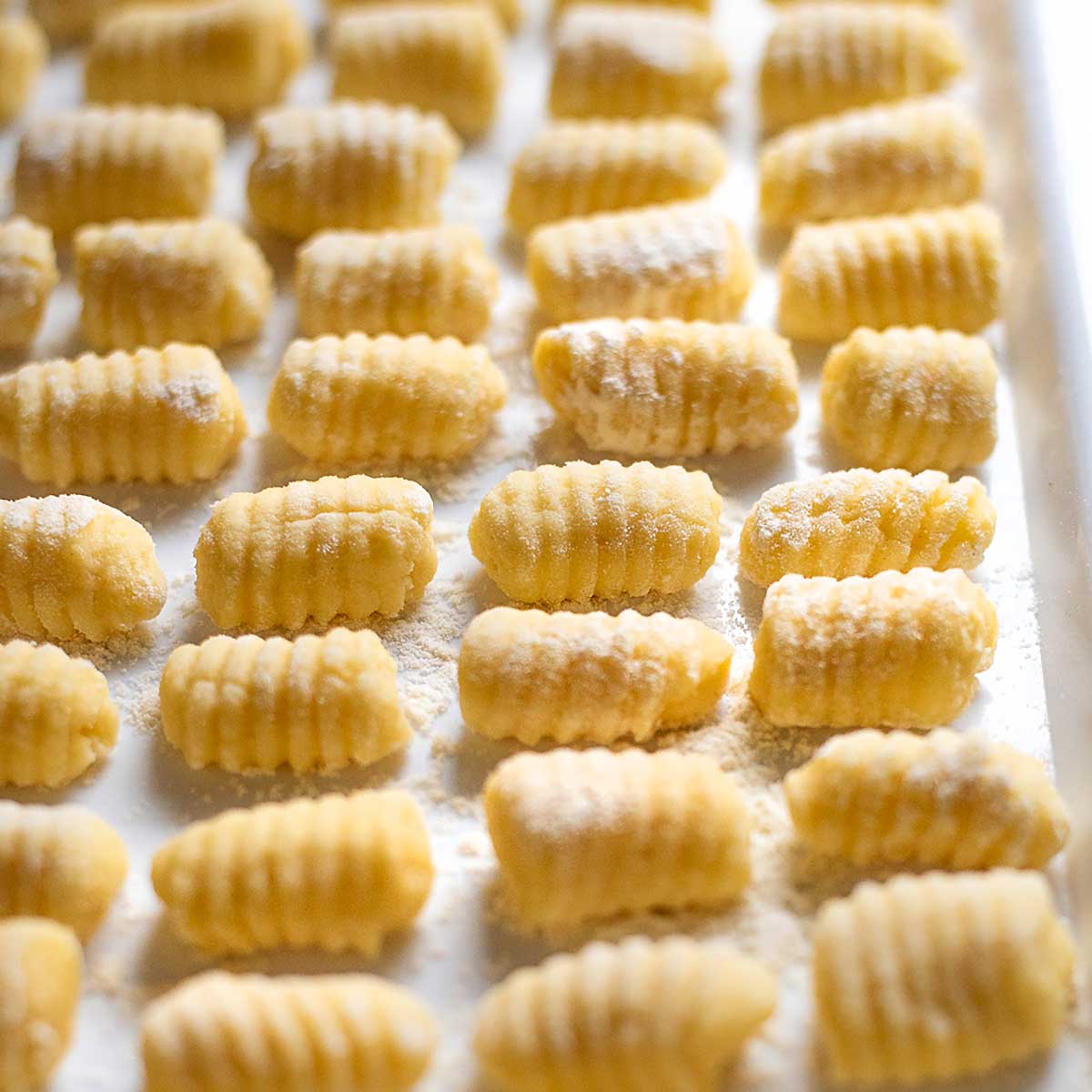 Potato gnocchi on a tray close up view.