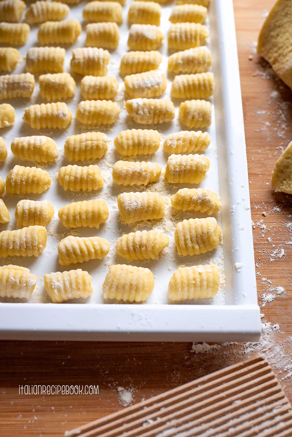 Potato gnocchi on a tray.