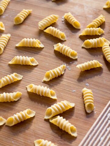 garganelli pasta on a wooden board