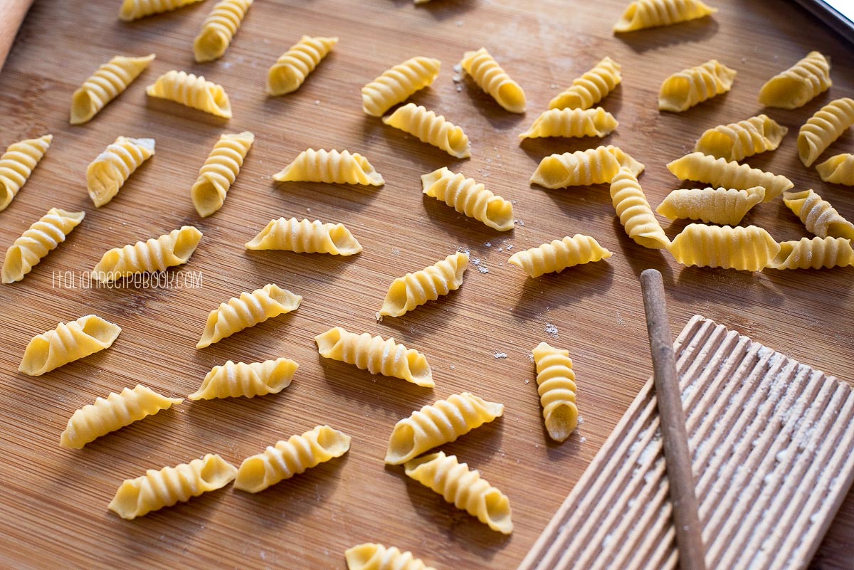 garganelli pasta on a wooden board