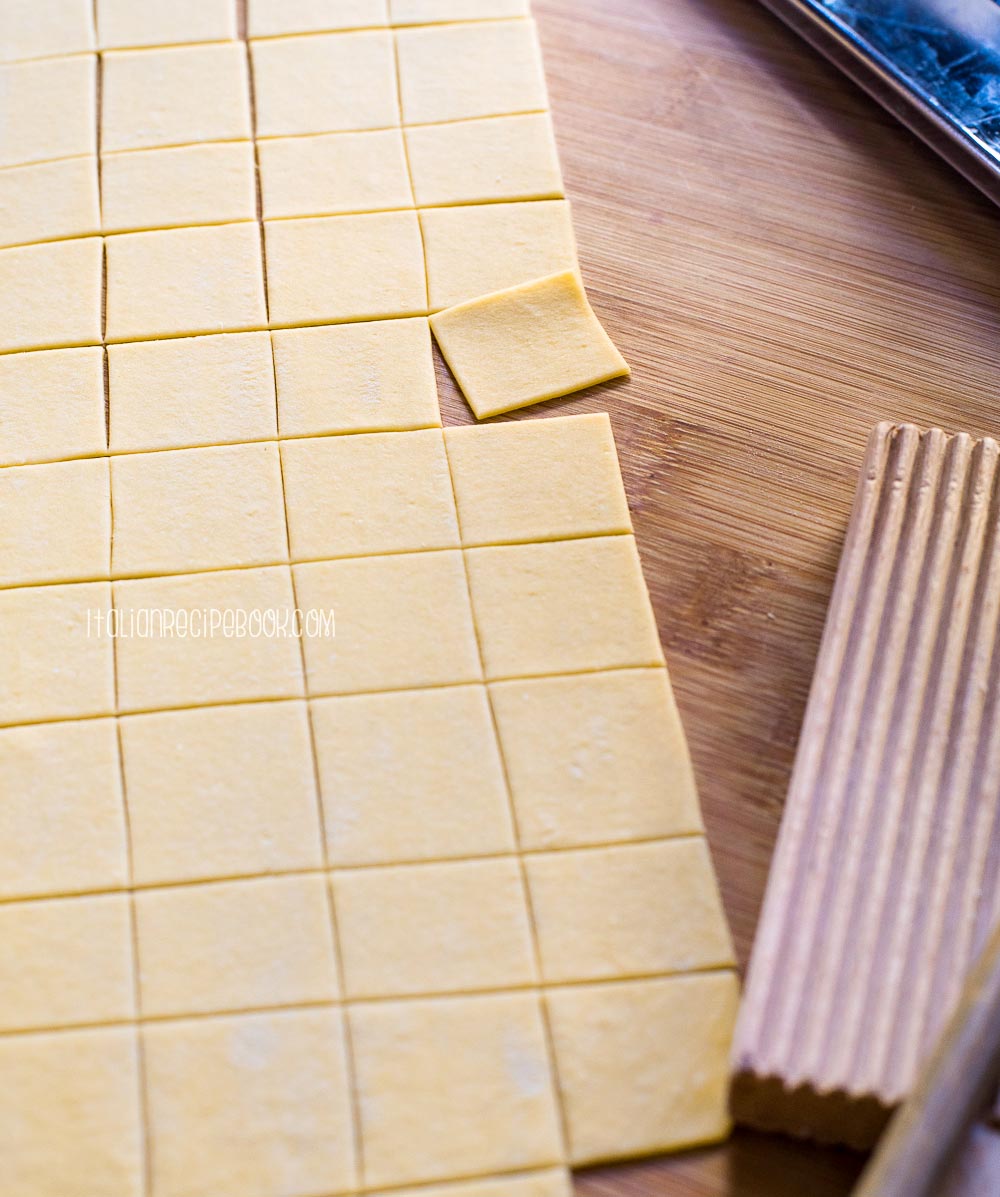 pasta squares on a wooden board