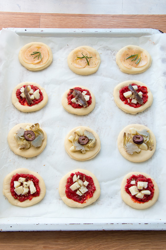 pizzette on a baking sheet