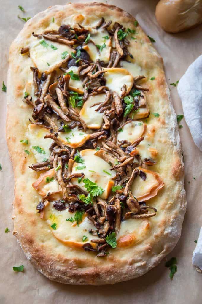 Pinsa with Mushrooms and Smoked Provolone Cheese