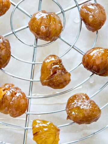 Marron glace on a wire rack.