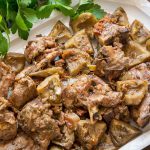 Lamb with artichokes on a serving plate