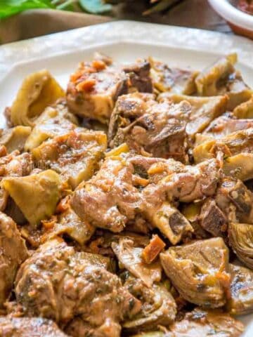 Lamb and artichoke stew on a serving plate.