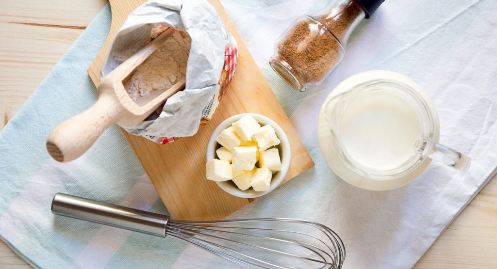 ingredients for bechamel sauce (flour, butter, milk, nutmeg, salt)