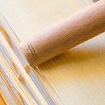 making tonnarelli with chitarra