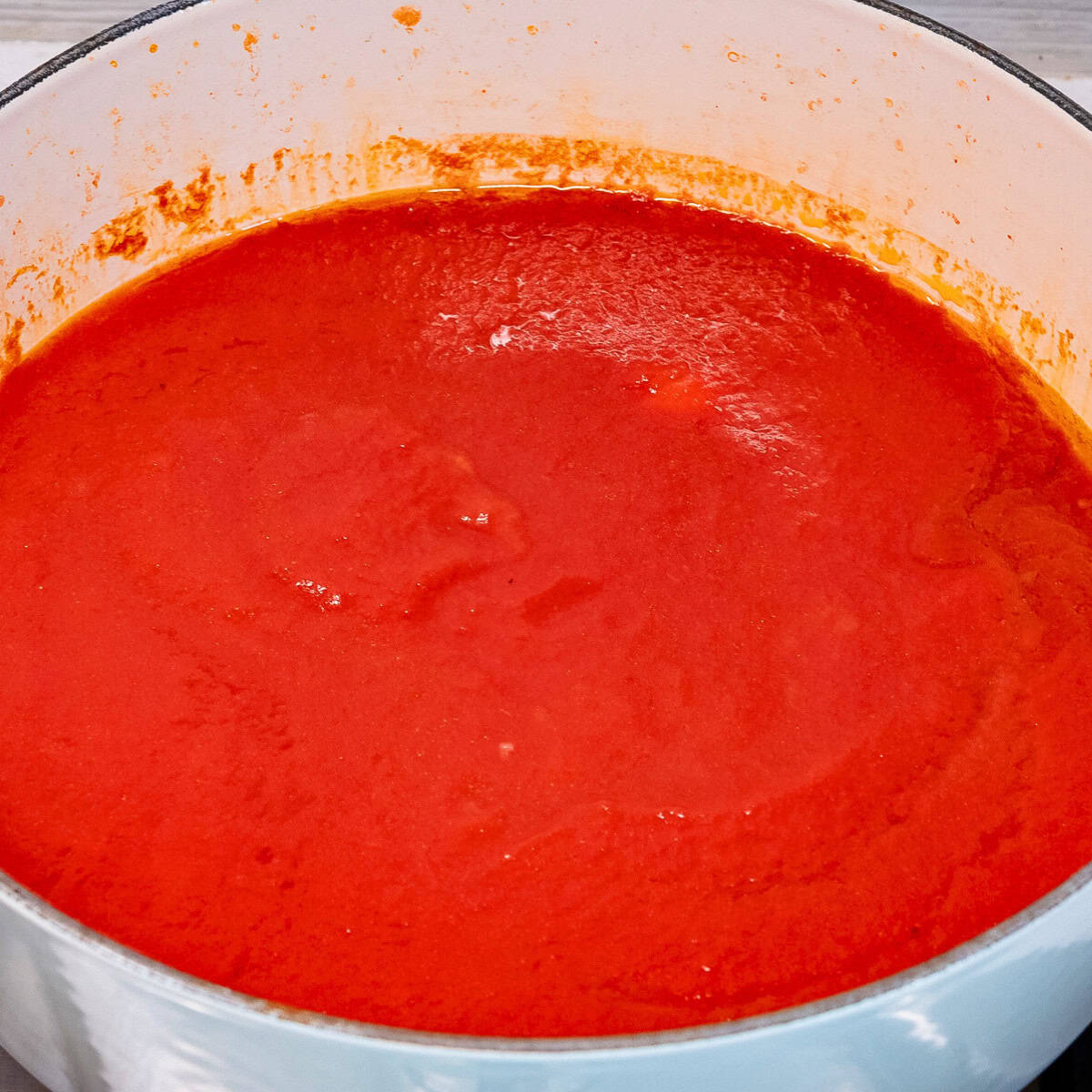 Simmering tomato.