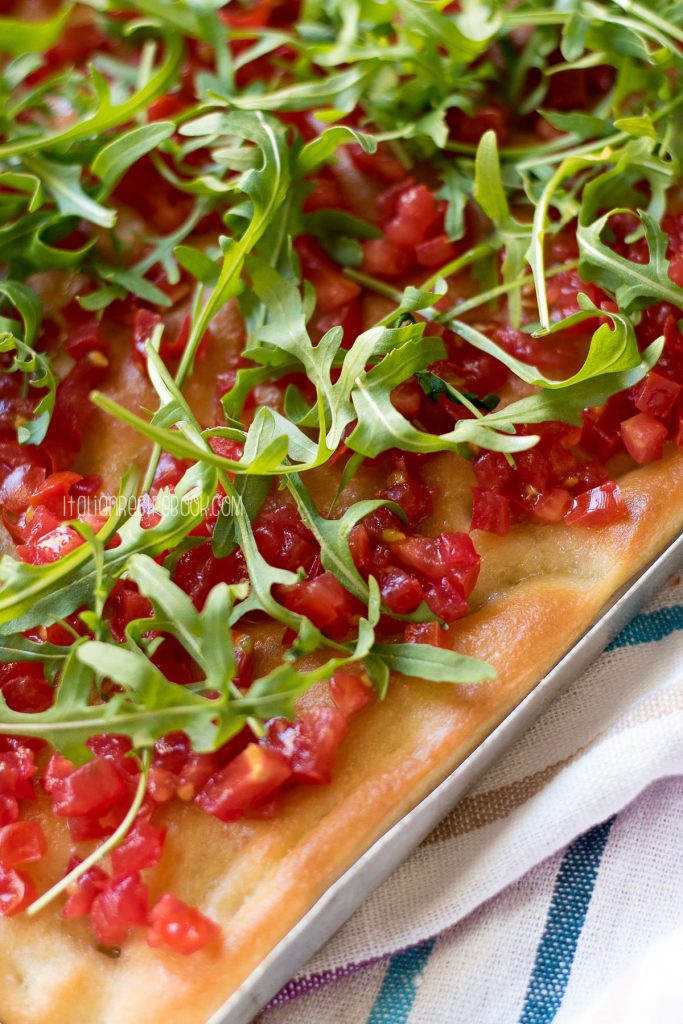 focaccia with tomatoes and arugula