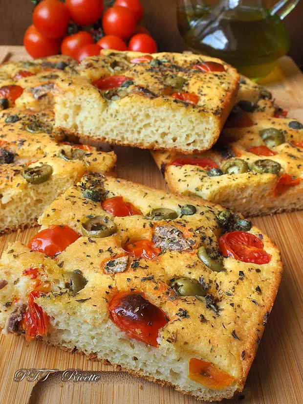 focaccia with cherry tomatoes, olives and anchovies