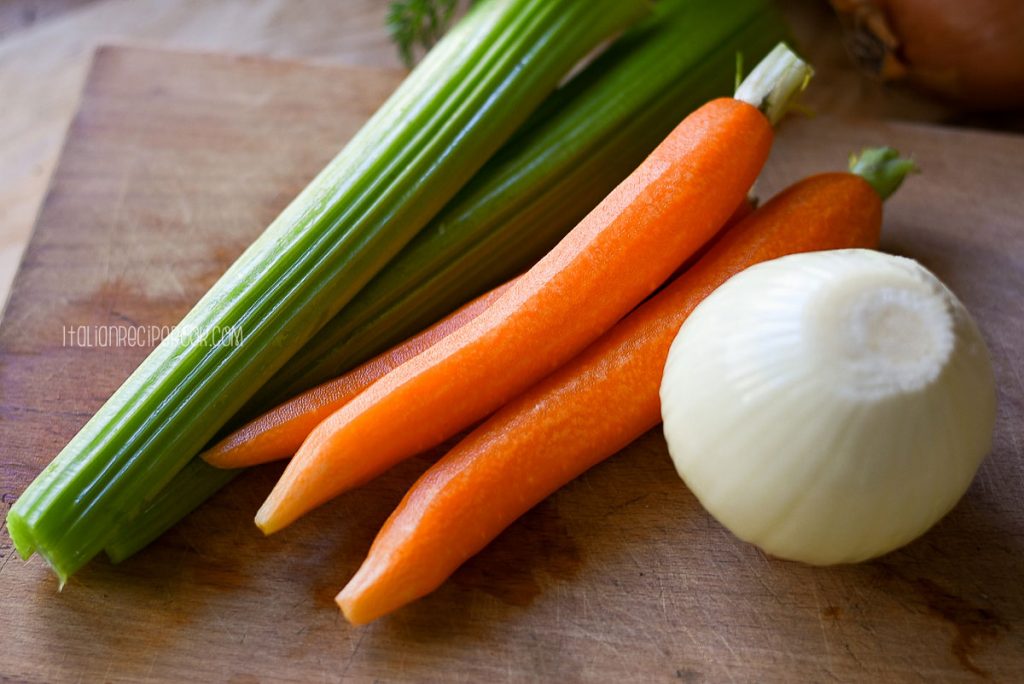 washed and peeled celery, carrots and onion