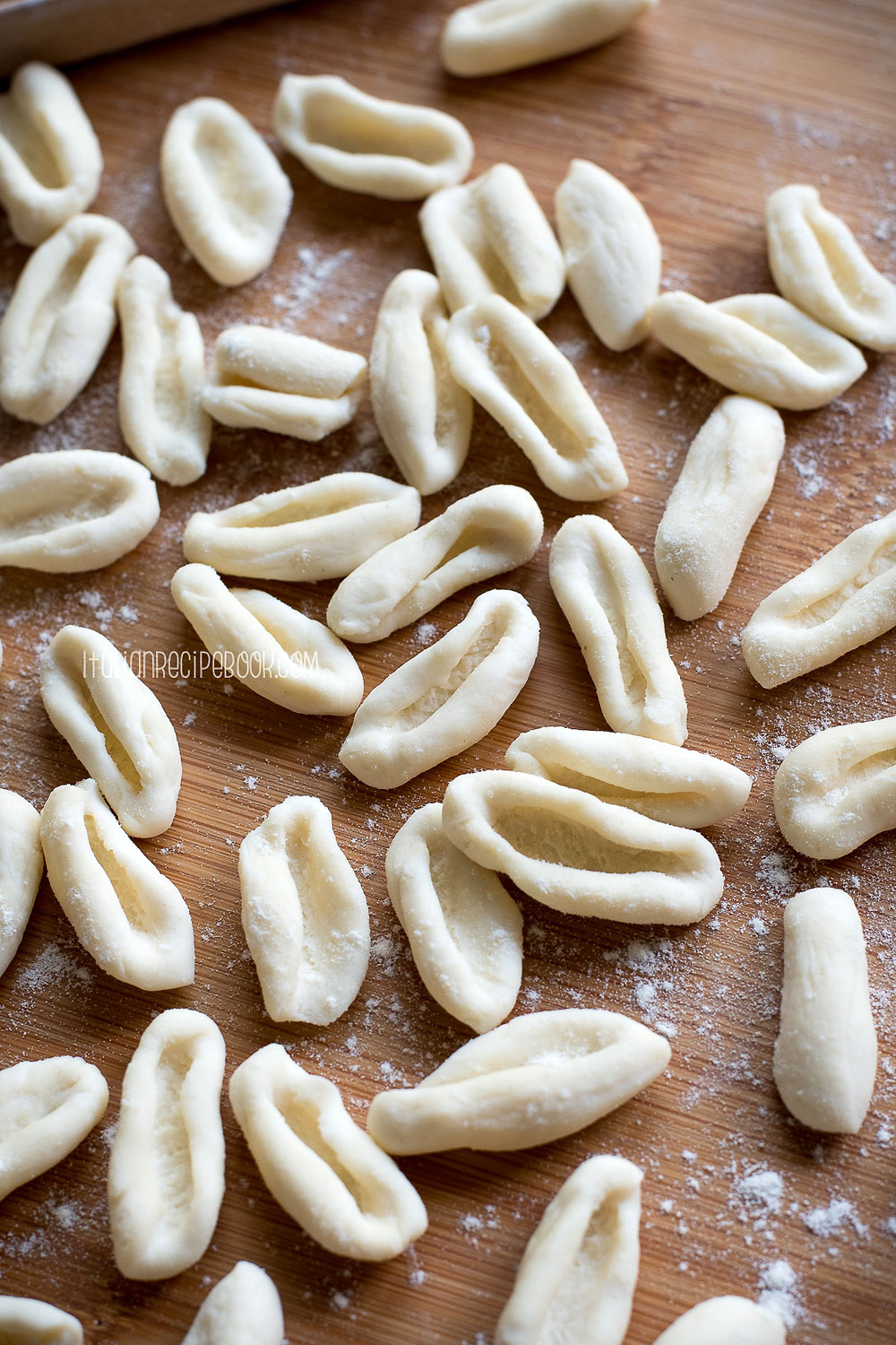 Ricotta cavatelli on a wooden board.