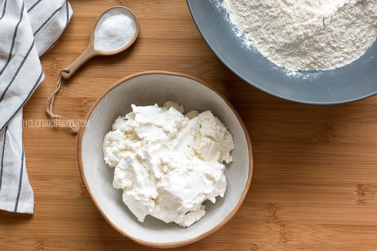 ricotta cavatelli ingredients - bowl of ricotta, flour and salt