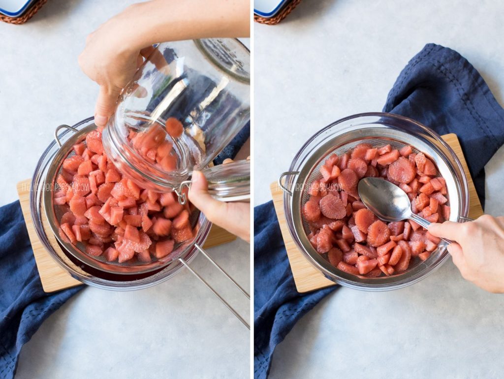 Straining strawberries from alcohol.
