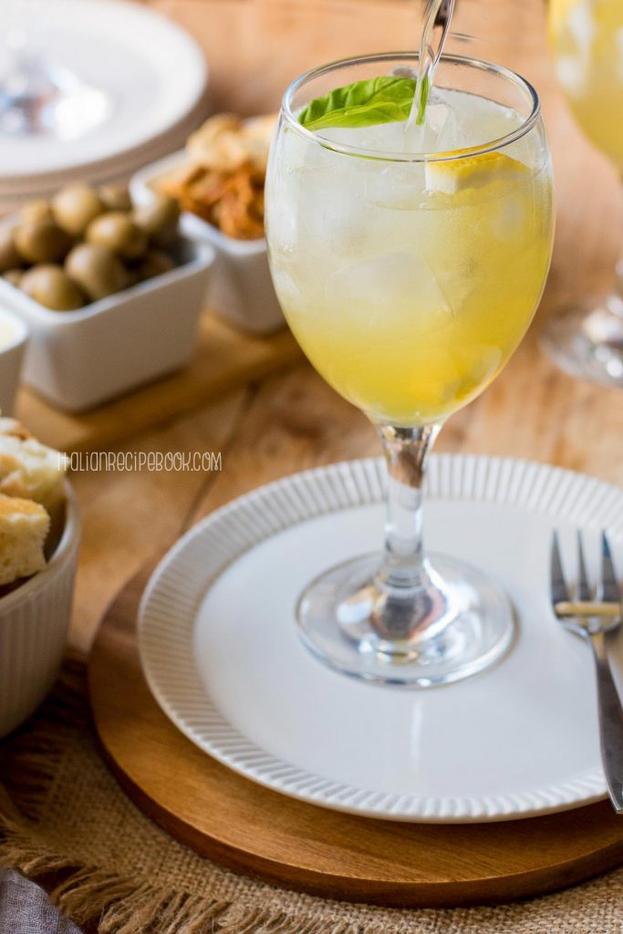 Topping Limoncello Spritz with soda water.