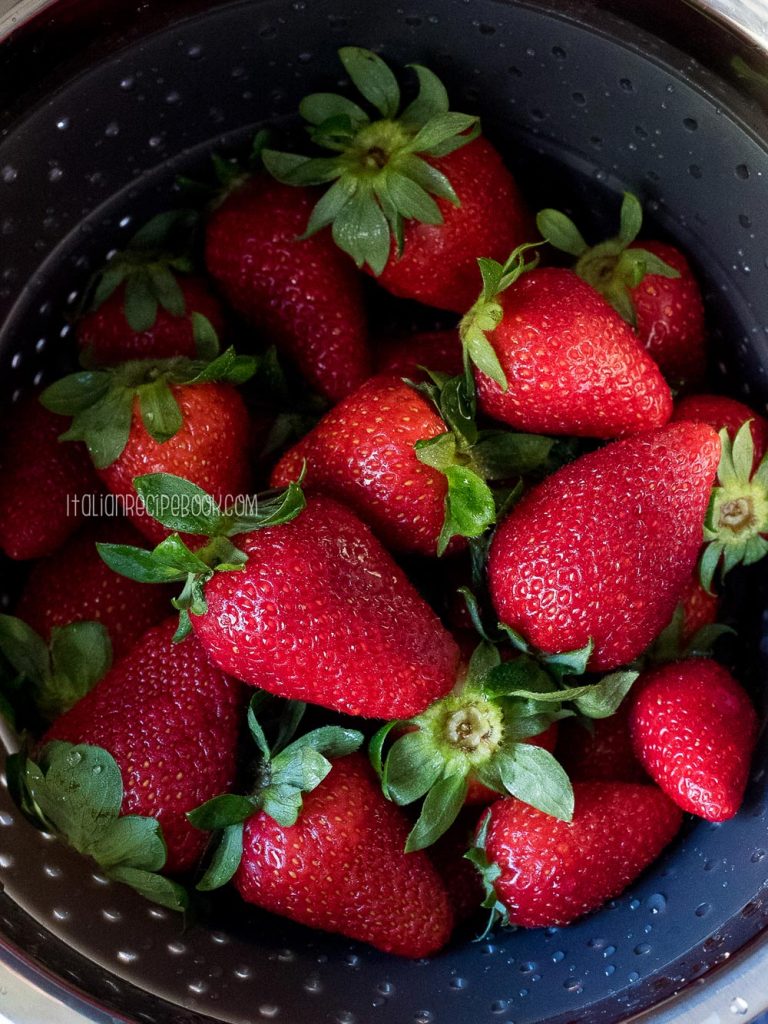 Washed fresh strawberries in a colander.