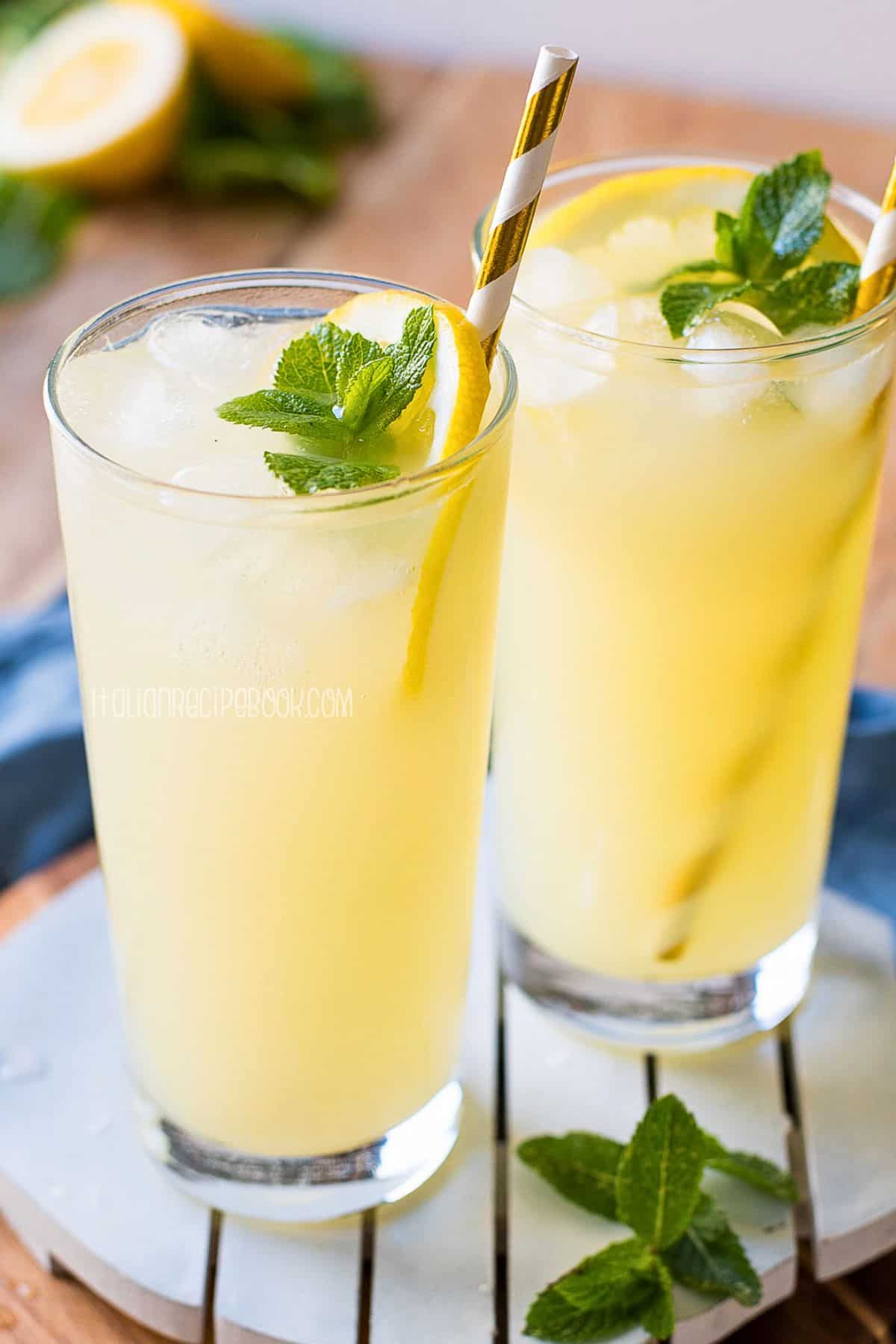 Italian lemonade in a tall glass garnished with mint.