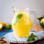 Italian Lemonade in a pitcher with mint leaves.