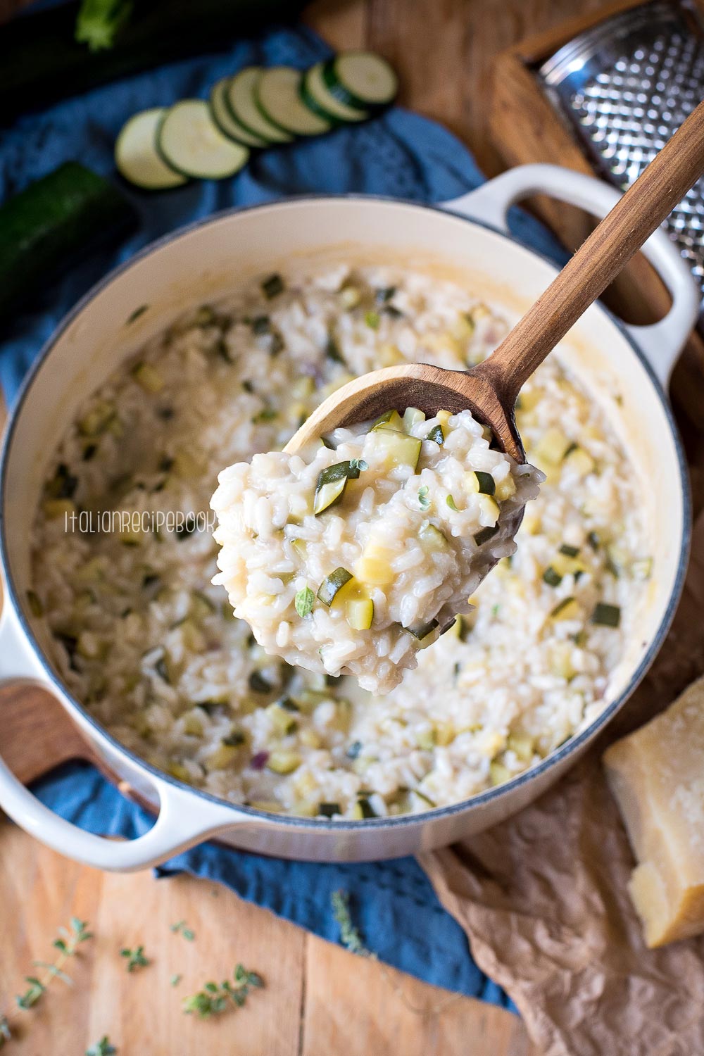 a spoon with zucchini risotto