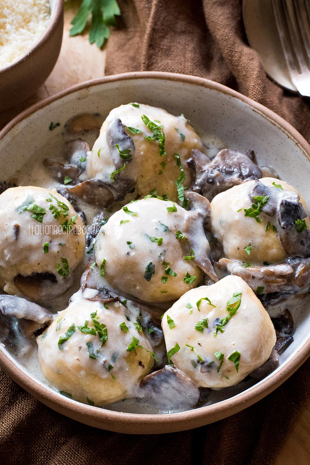 ricotta ball in mushroom sauce served in a bowl