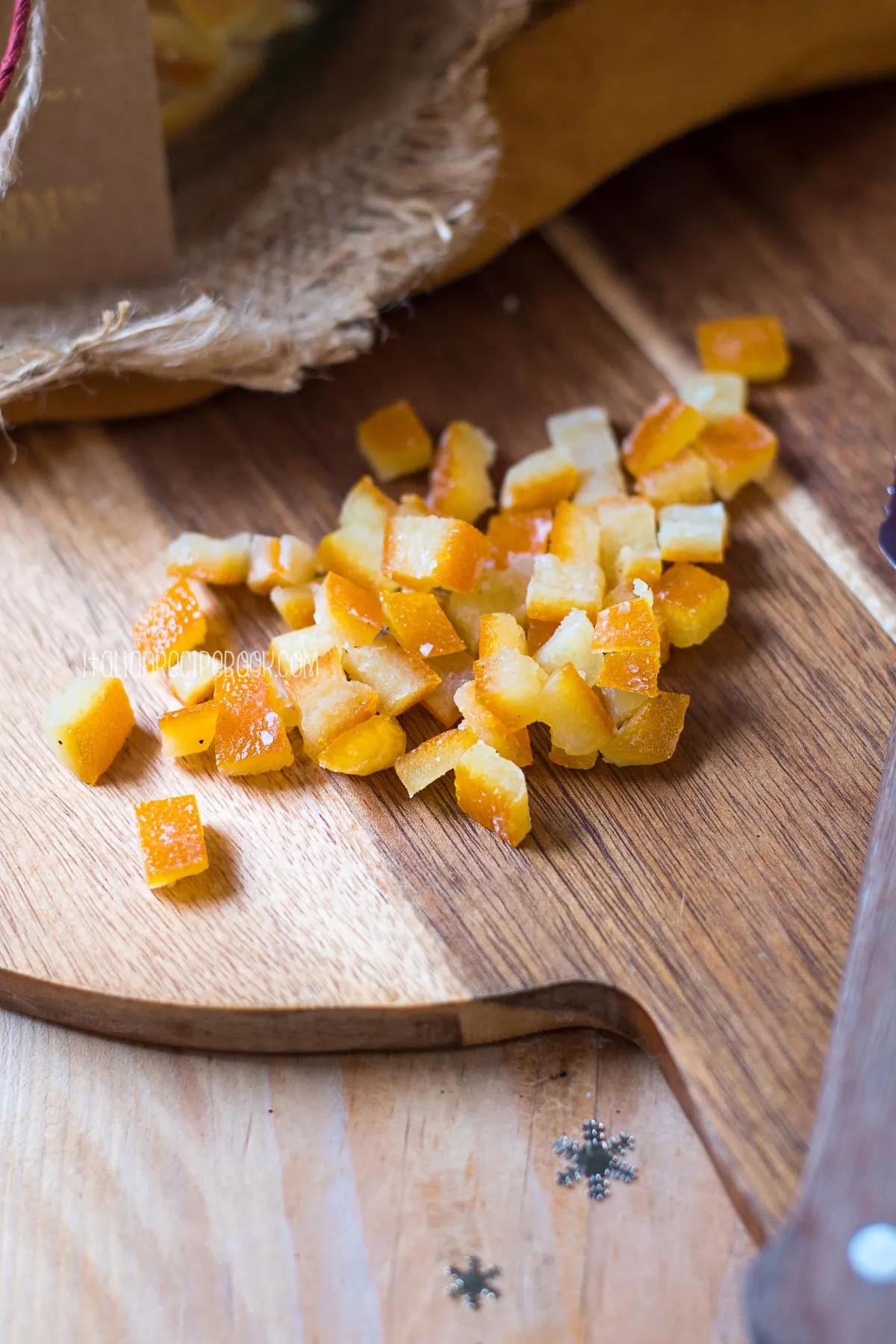 candied orange cubes on a cutting board