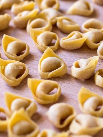 handmade tortellini on a wooden board