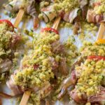 shrimp zucchini skewers on a baking sheet