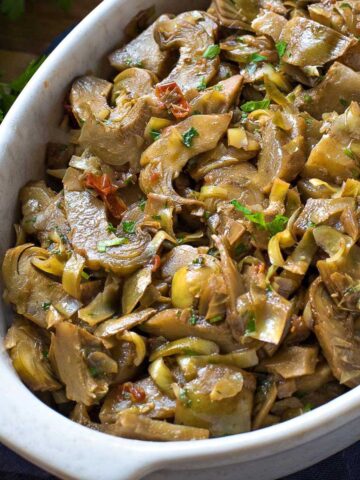 Braised Artichokes in a serving dish.