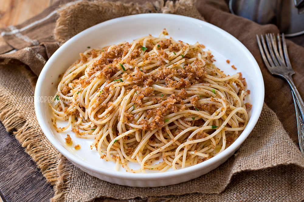 long pasta with breadcrumbs on a plate