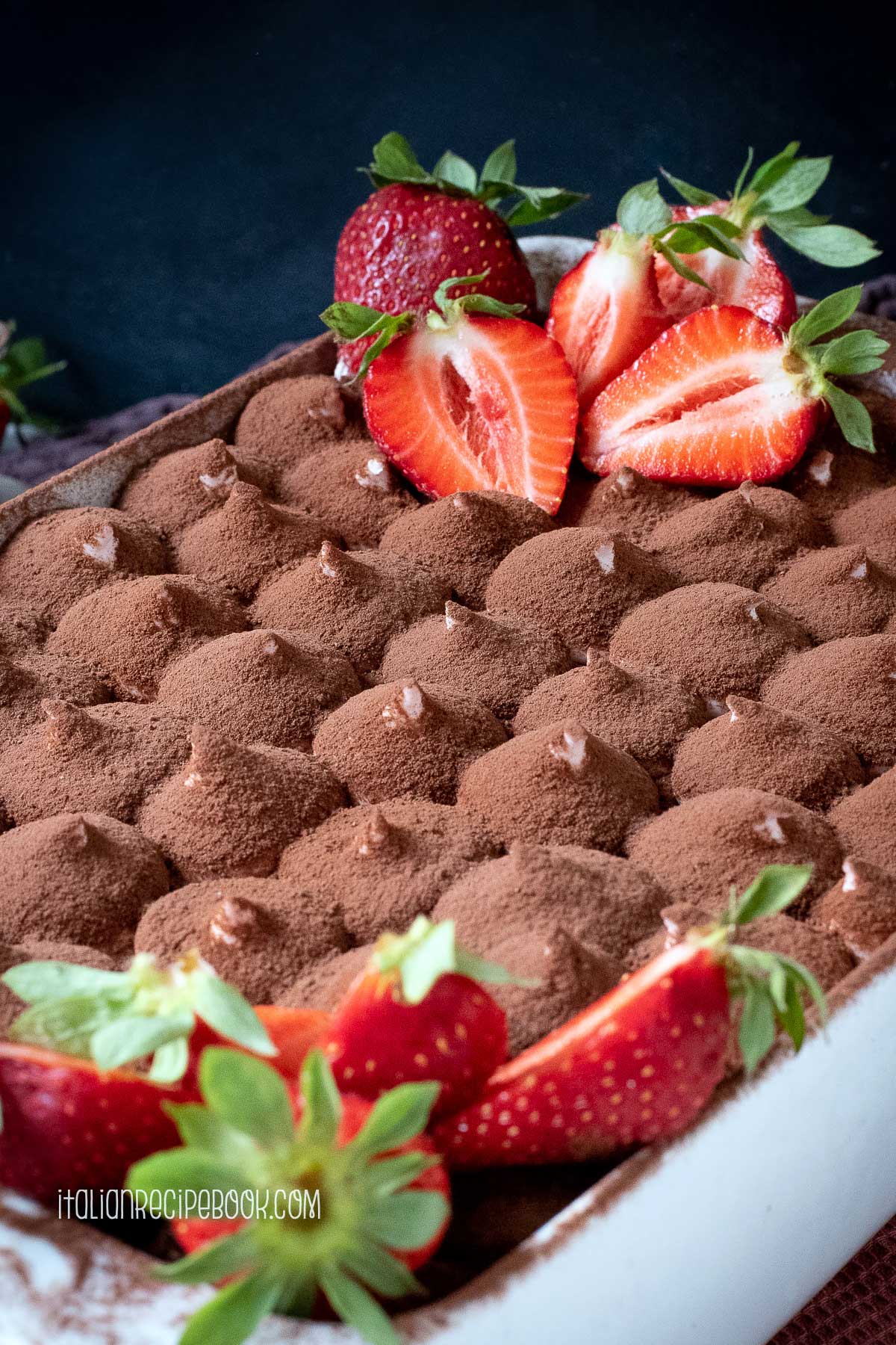 strawberry tiramisu dusted with cocoa powder