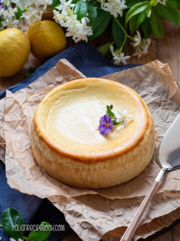 lemon ricotta cheesecake with a cake spatula on the side