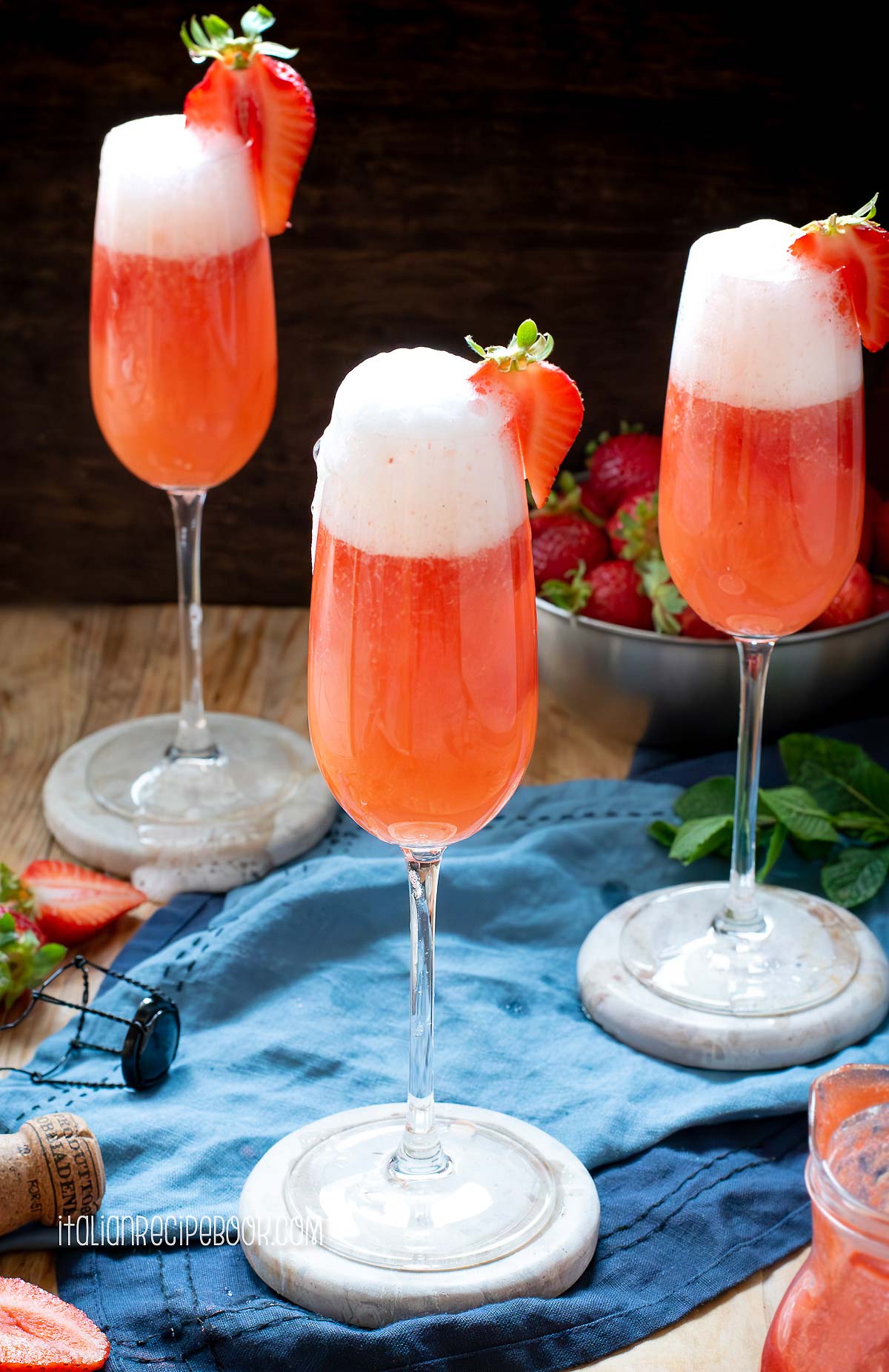 strawberry prosecco cocktail in flute glasses