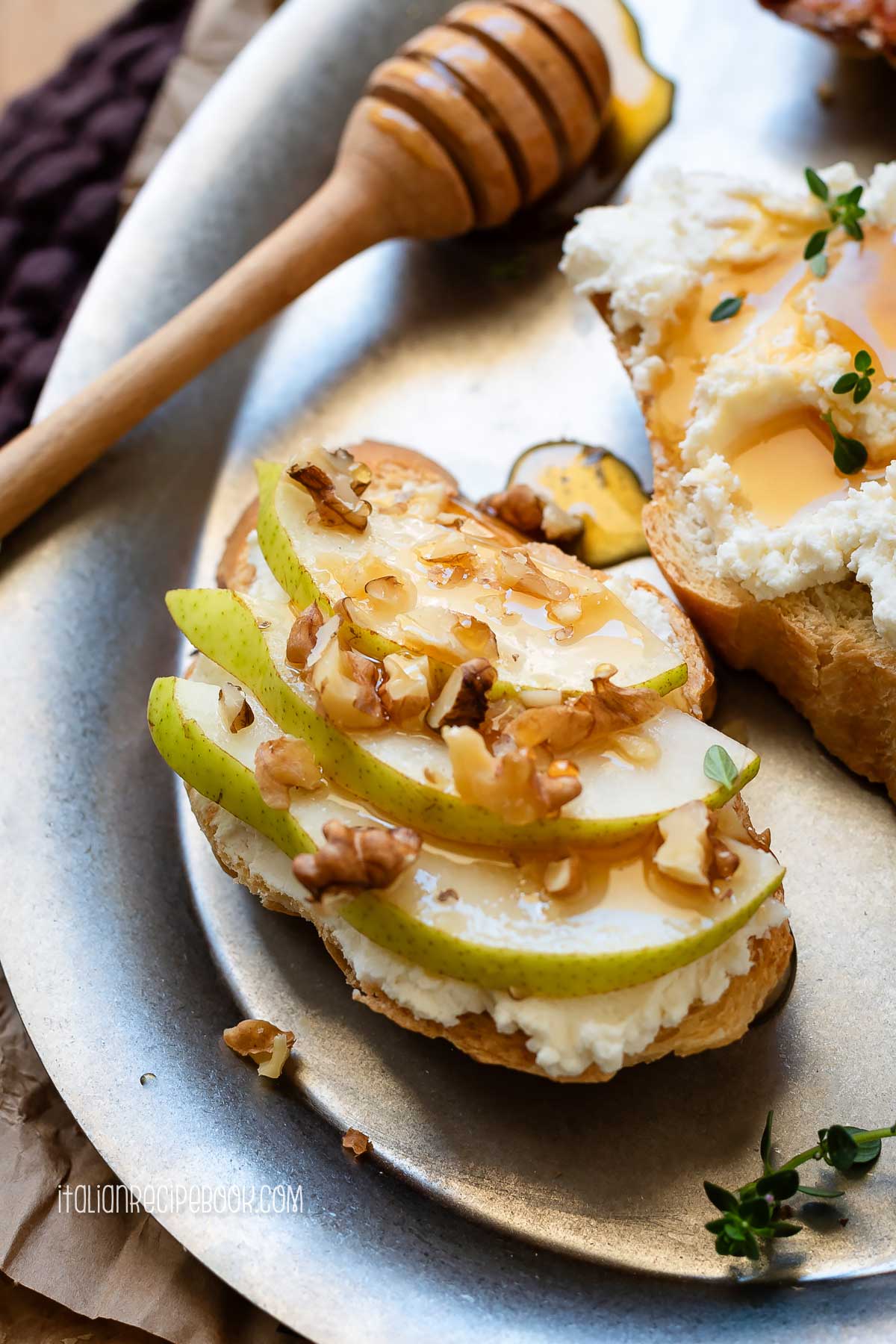Ricotta crostino topped with pears, walnuts and honey.