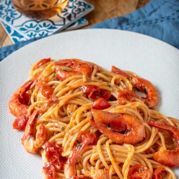 Spaghetti with shrimp tomato sauce on a plate.