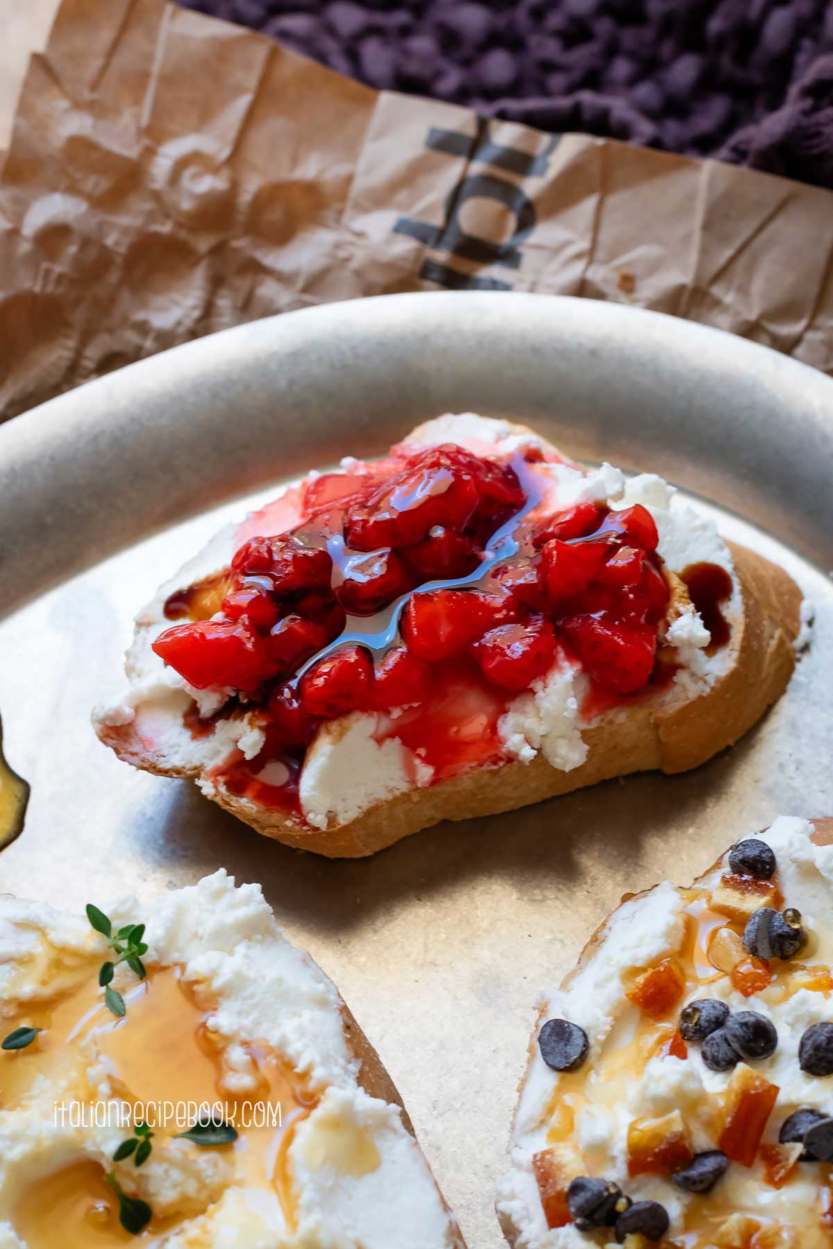 Ricotta crostino topped with strawberries and aged balsamic.